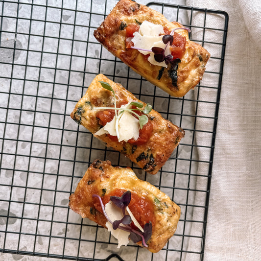 Potato, Parmesan & spinach Bake served with spicy Tomato Relish